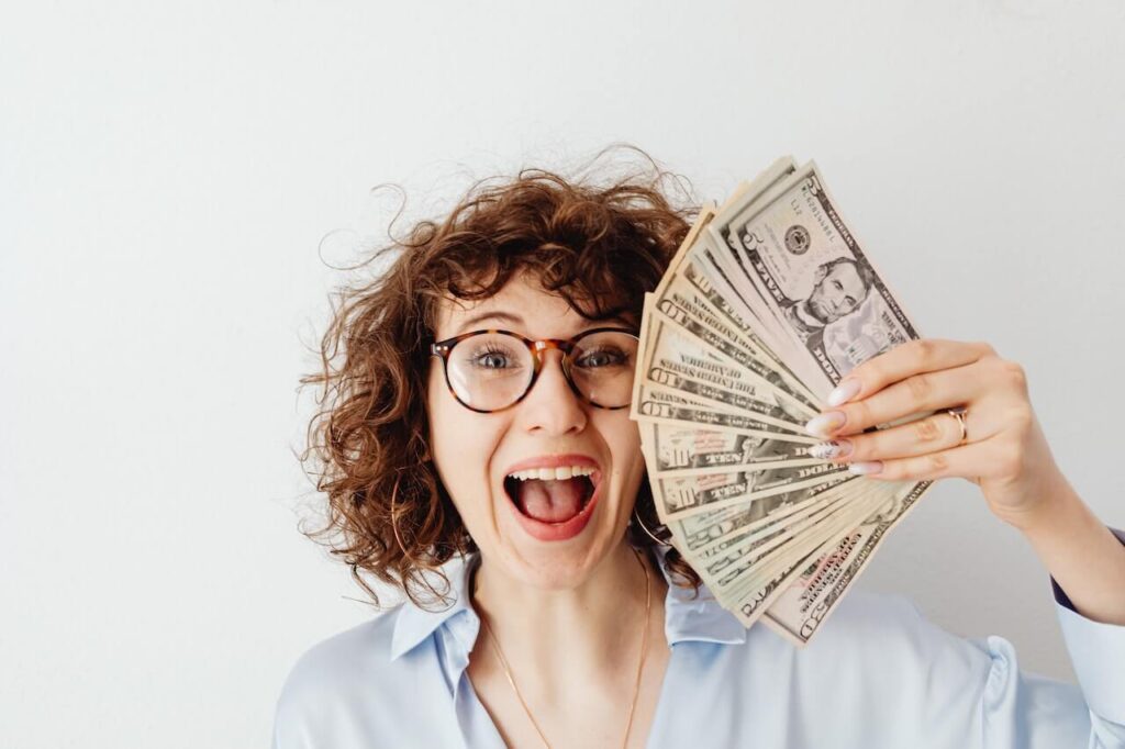 Happy woman holding money
