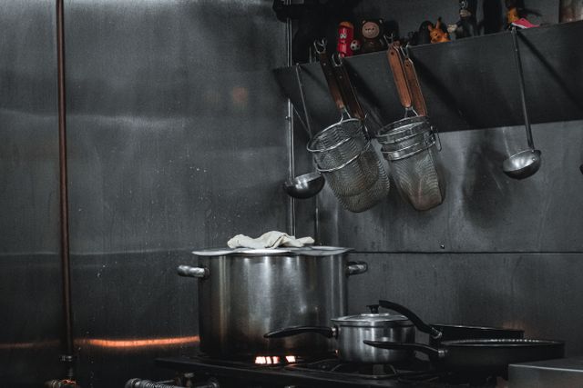 Stainless steel prep table and shelving in a commercial kitchen